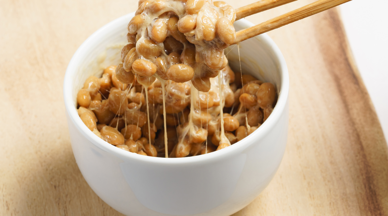 Image of a bowl full of Natto, being eaten with chopsticks