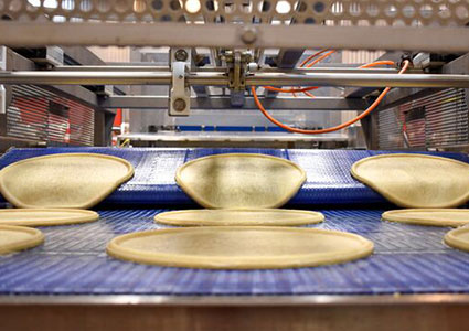 Pizza bases on production line