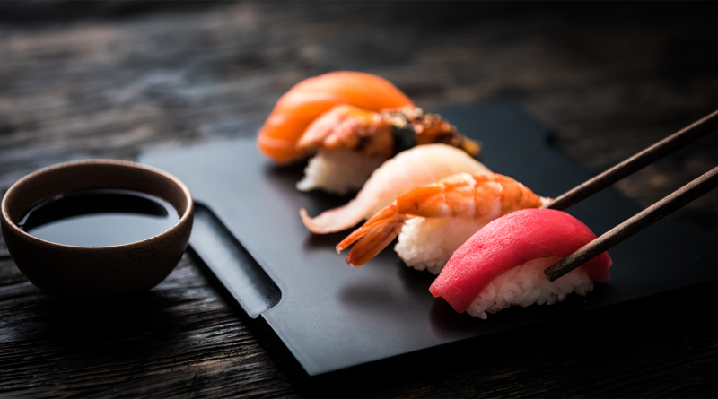 High-end luxury sushi sat on a woodern table to support StoneAge Omakase article