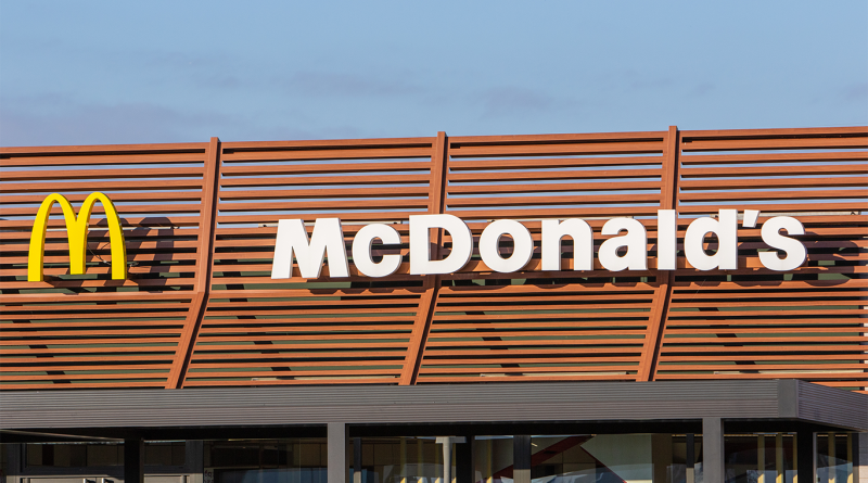 Mcdonald's logo on building to support Snack Wrap 2025 release article