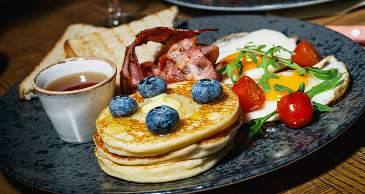 Fried breakfast with pancakes & blueberries