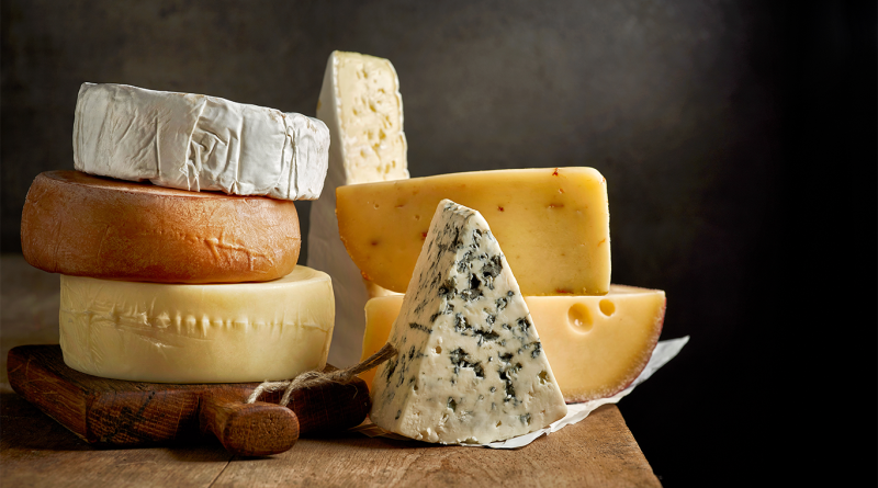 Different types of cheeses stacked on top of each other to support world's best cheese article