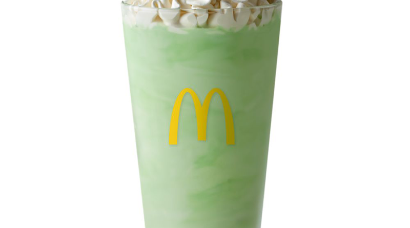 Glass of the McDonalds Shamrock Shake with whipped cream on top