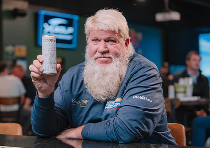 Golfer John Daly with a can of Good Bay Vodka