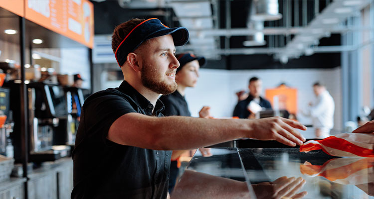 employee working at a Dodo Pizza restaurant