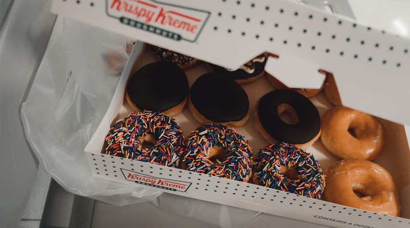 Krispy Kreme bets on fairground nostalgia with fall doughnuts Krispy Kreme Fall Fair Collection doughnuts featuring cotton candy, caramel churro, apple pie, and kreme puff flavors