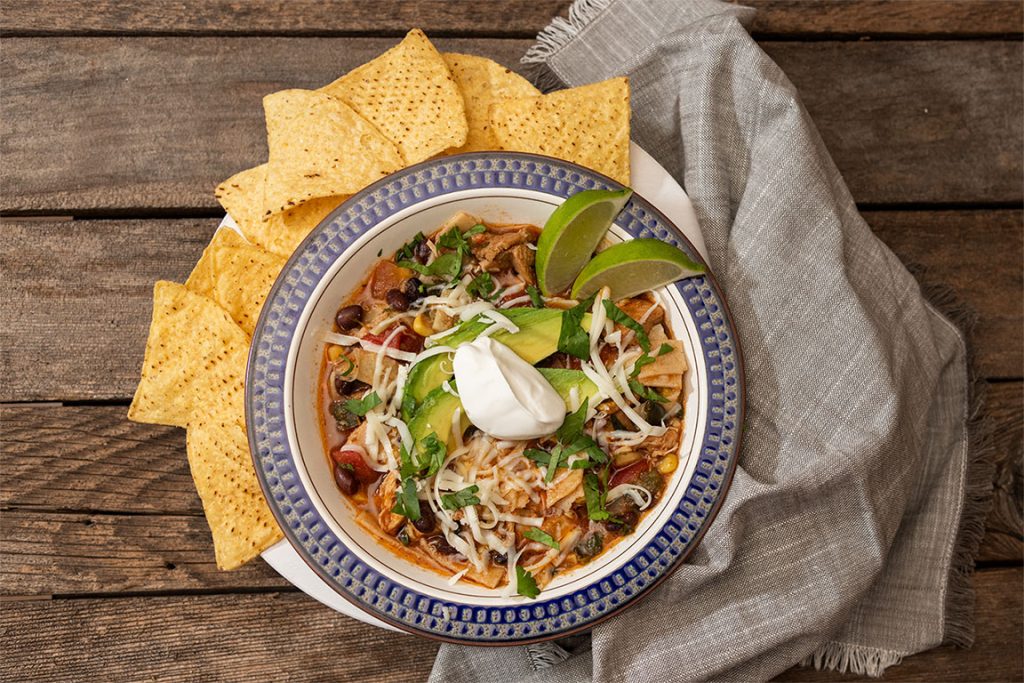 A bowl of Mexican chicken tortilla soup for the Fall Soup Recipes article