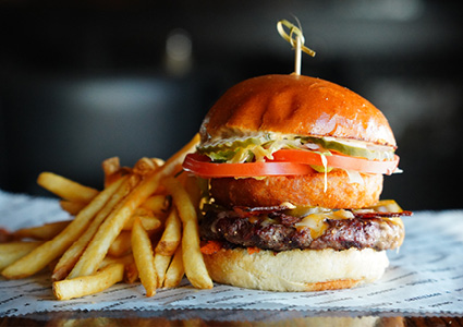 a gourmet burger and fries