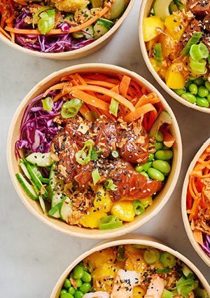 poke bowls, a Hawaiian dish typically consisting of diced raw fish served over rice and topped with various vegetables and sauces