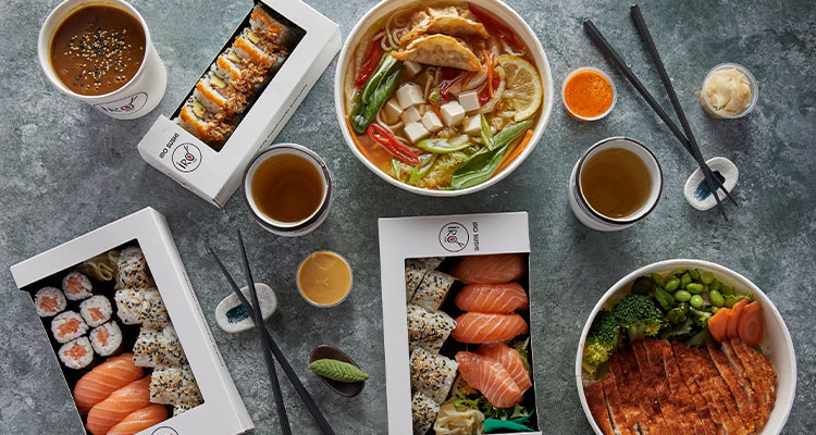 a spread of sushi and hot dishes from IRO Sushi