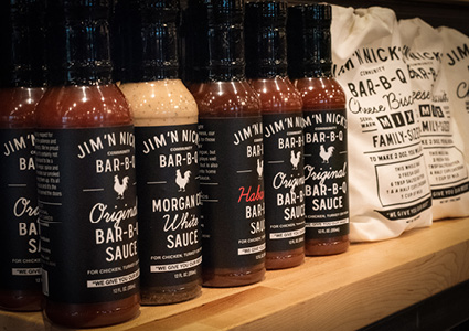 Jim 'N Nick's Bar-B-Q sauces, featuring their Original, Morgan County White, and Honey Habanero flavors