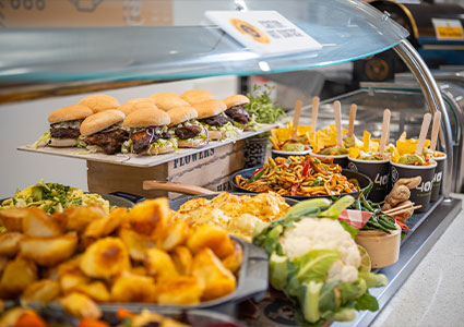 vibrant and plentiful food buffet or catering spread, featuring a variety of dishes