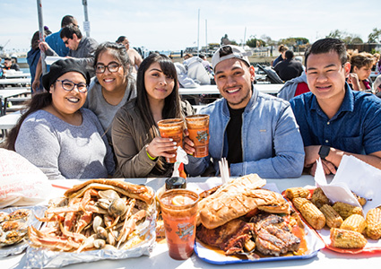group of people enjoying a meal at the San Pedro Fish Market