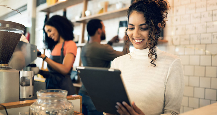 a person using a tablet to manage business operations