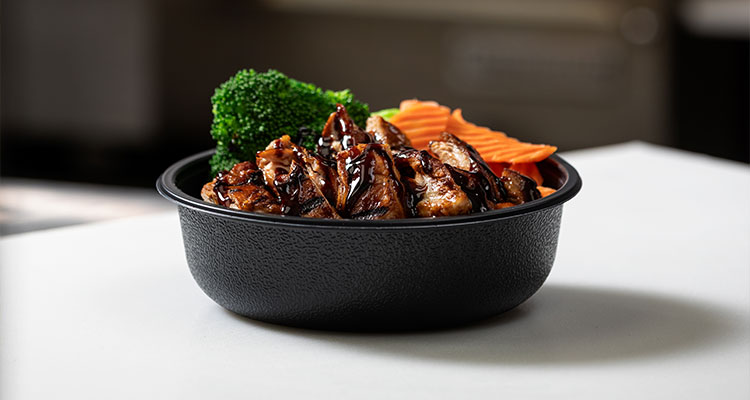 a Teriyaki Madness chicken bowl featuring glazed chicken, broccoli, and carrots