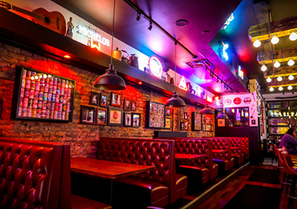 the interior of a vibrant, eclectic restaurant or bar