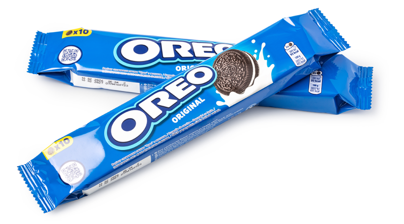Three blue Oreo Original cookie packs arranged on a light grey background, featuring the brand's iconic logo and classic chocolate sandwich cookie imagery.