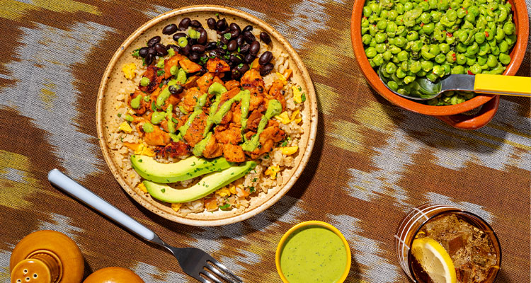 a vibrant chicken and rice burrito bowl