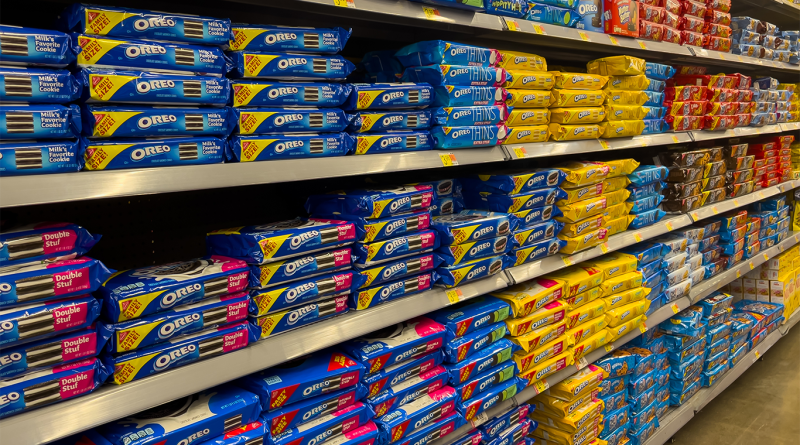 Variety of cookies for sale on the shelves in a supermarket